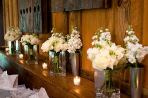 display bouquets and pew marker at the reception