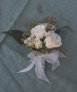 corsage of white spray roses