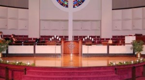 our candelabras in the church with huricanes along the stage