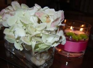 floating candles illuminate the hydrangeas