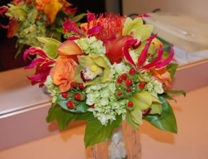 bride's bouquet of glorisa lilies, green hydrangeas, protea pincushion, spray roses, orchids, and hypericum