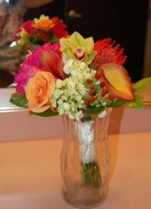 bride's bouquet of glorisa lilies, green hydrangeas, protea pincushion, spray roses, orchids, and hypericum