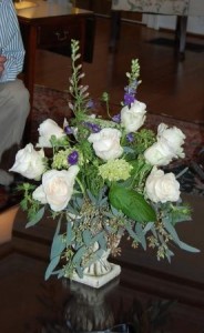 white roses and delphineum arrangement