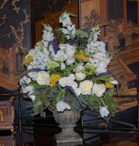 large mixed flower arrangement of tulips, garden roses, snap dragons, stock, yarrow, and queen annes lace
