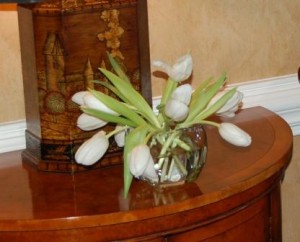 white tulips in a small vase