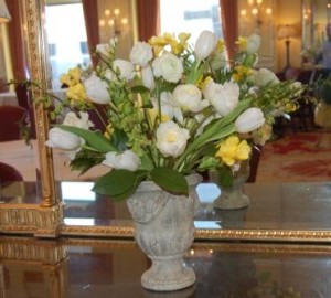 arrangement of tulips, roses, and yellow freesia