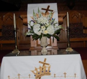 wedding centerpiece of hydrageas, tulips, delphineum, and stock