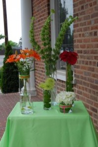 deconstructed cylinders of gerberas, spider mums, and bells of ireland