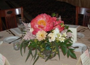 table arrangement with coral peonies