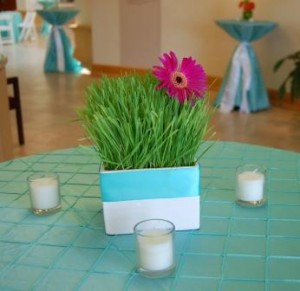 table centerpiece with gerbera in a vase of grass