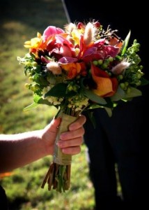 spectacular bridesmaid bouquet of purple, orange, and greens