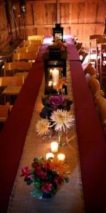 long table with flowers, lanterns, and votives